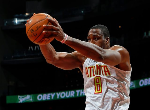 Dwight Howard of the Atlanta Hawks grabs a rebound during a NBA game at Philips Arena in A