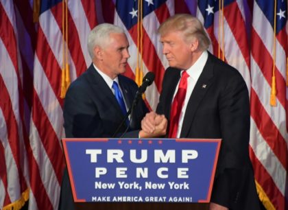 Republican presidential-elect Donald Trump (right) shakes hands with vice president-elect