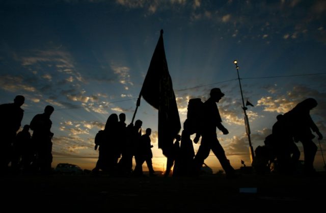 Shiite Muslim pilgrims walk tawards the Iraqi city of Karbala to take part in the Arbaeen