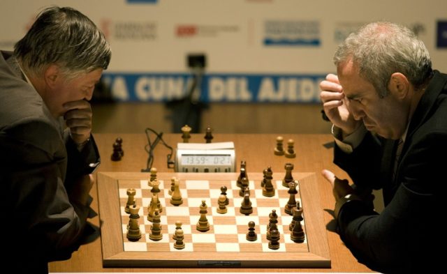 Chess legends Garry Kasparov (right) and Anatoli Karpov play chess in Valencia, Spain, in