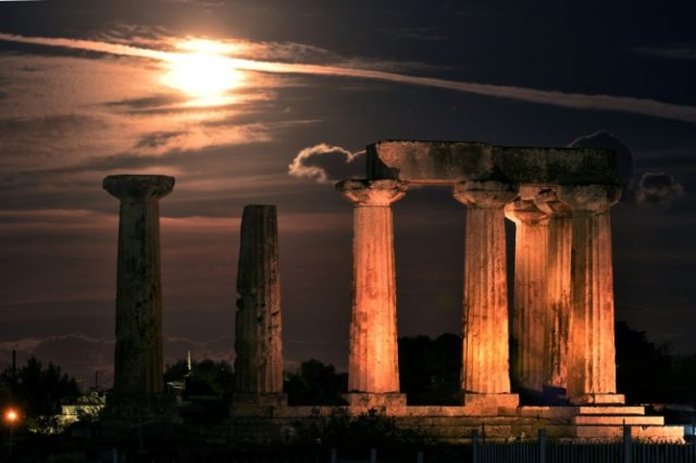 The "supermoon" is pictured above the Temple of Apollo in Ancient Corinth on November 14,