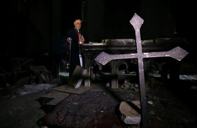 Archbishop Yohanna Petros Mouche of Mosul prays at the St. George Syriac Catholic Church i