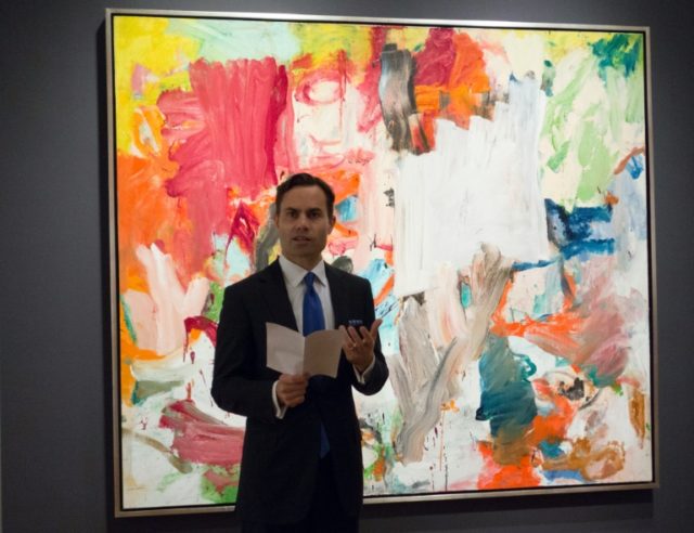 A Christie's official speaks in front of "Untitled XXV" by Willem de Kooning in New York d