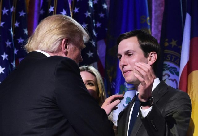 Republican presidential nominee Donald Trump shakes hands with son-in-law Jared Kushner (R