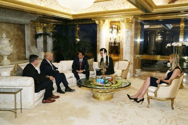 Japan Cabinet Secretariat picture shows Prime Minister Shinzo Abe (3L) meeting with US Pre