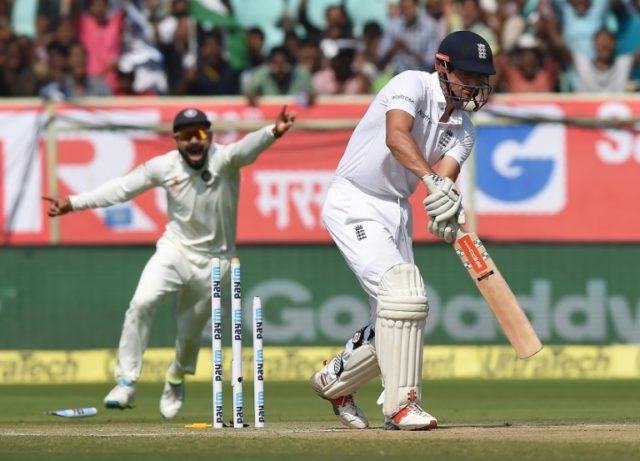 India's Virat Kohli (left) celebrates the wicket of England captain Alastair Cook on the s