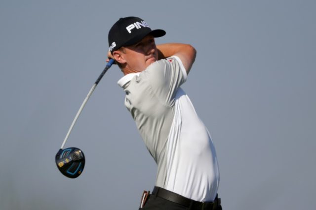 Mackenzie Hughes of Canada plays his tee shot on the 15th hole during the first round of t