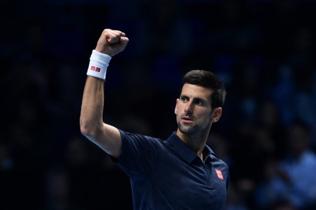 Serbia's Novak Djokovic celebrates beating Japan's Kei Nishikori during their men's semi-f
