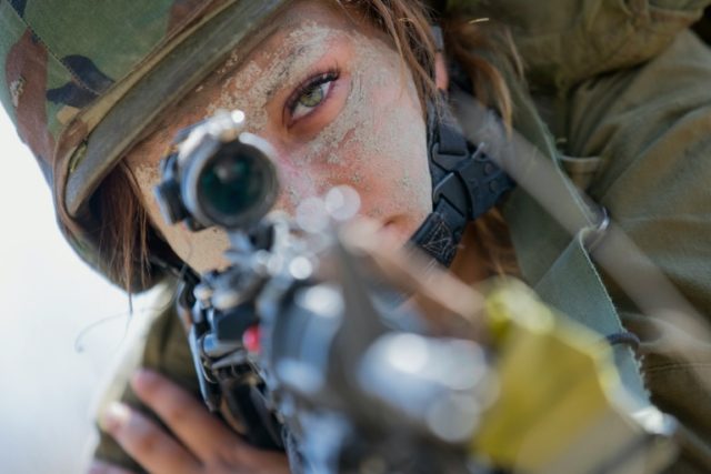 An Israeli female soldier from the Bardalas battalion takes part in training at a military