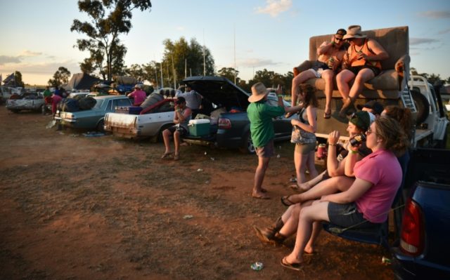 People drink in their cars before a "Bachelor and Spinster" ball in the town of Ariah Park