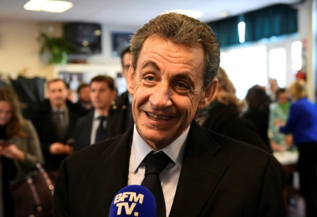 Former French president Nicolas Sarkozy answers journalists' questions after voting in Par