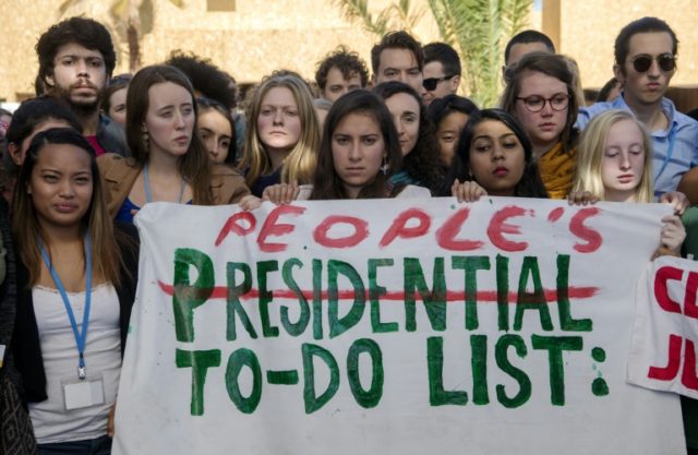 American students protest outside the UN climate talks in Marrakesh in reaction to Donald