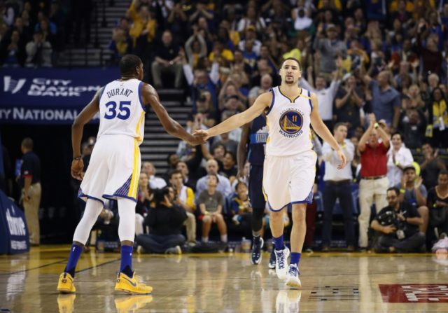 Kevin Durant (L) led the scoring with teammate Klay Thompson (R) adding 29 as the Warriors