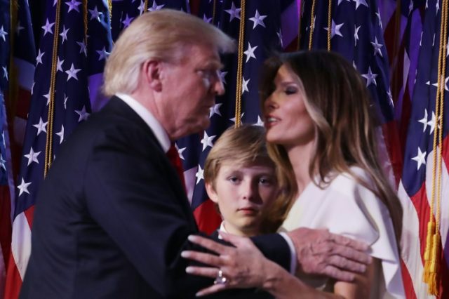 President-elect Donald Trump embraces his wife Melania Trump, as their son Barron looks on