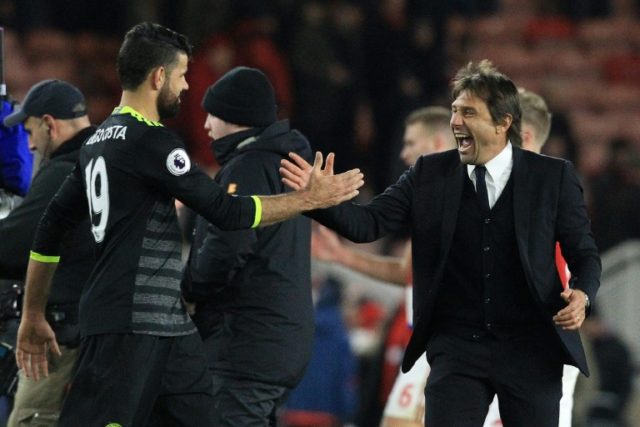 Chelsea's head coach Antonio Conte (R) reacts as he congratulates Chelsea's striker Diego