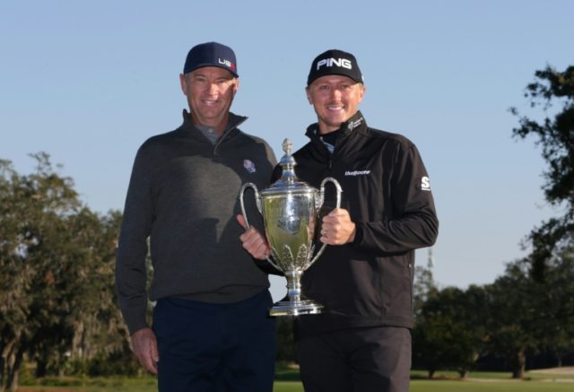 Mackenzie Hughes (right) and Davis Love III with the trophy after the RSM Classic on Novem