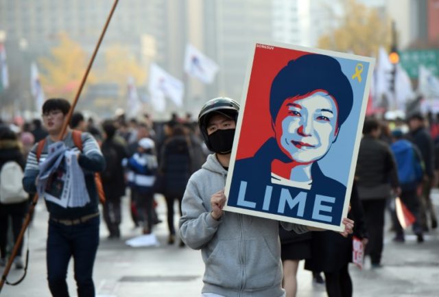 South Korean lawmakers are under pressure to oust President Park Guen-Hye, with mass prote