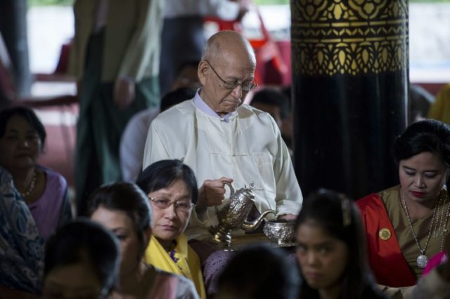 Taw Phaya (C), 93, grandson of King Thibaw, attends a ceremony with relatives at Mandalay'