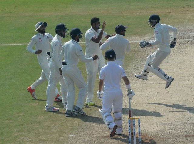 India's Ravichandran Ashwin (4L) celebrates the wicket of England's Ben Duckett (2R) with