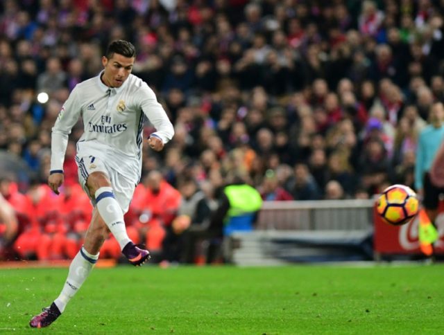 Cristiano Ronaldo scores for Real Madrid against Atletico de Madrid at the Vicente Caldero