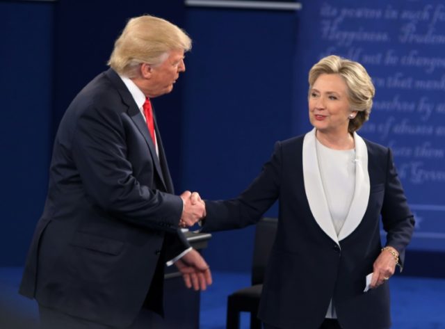 Hillary Clinton (right) and Donald Trump shake hands at the end of the second presidential
