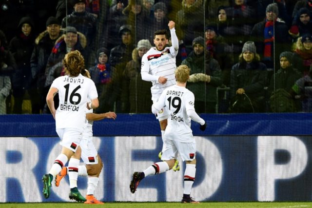 Leverkusen's players celebrate a goal on November 22, 2016
