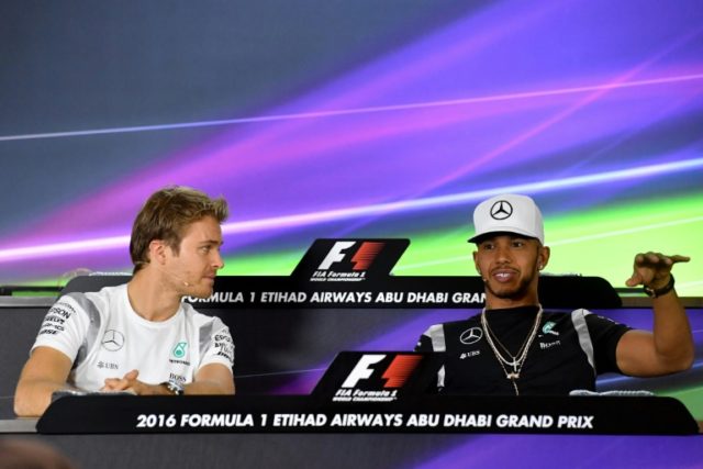 Mercedes AMG Petronas drivers Nico Rosberg (L) and Lewis Hamilton attend a press conferenc