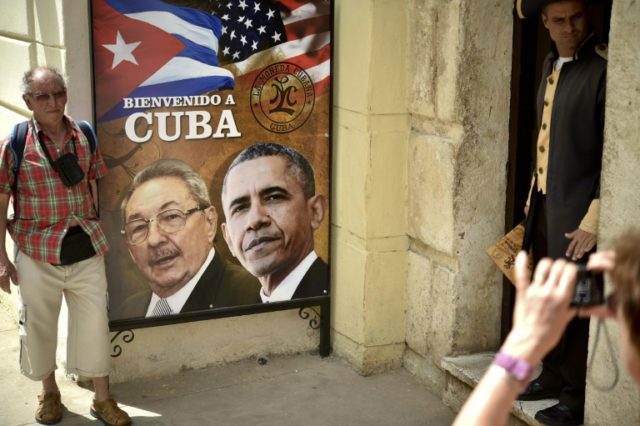 A poster in Havana shows Cuban and US Presidents Raul Castro and Barack Obama, who in Dece
