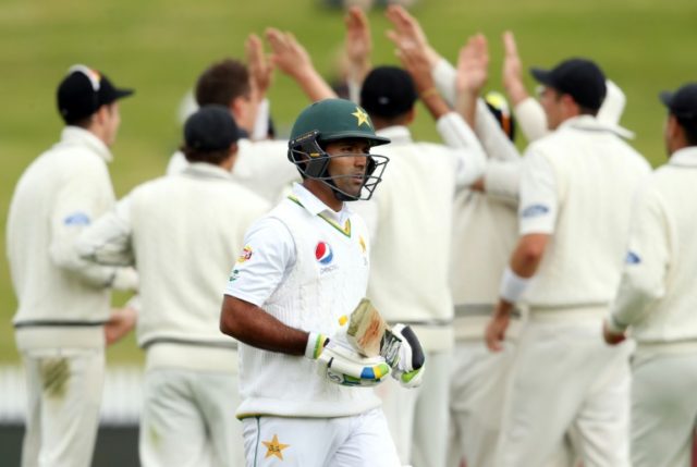 New Zealand players celebrate the wicket of Pakistan's Asad Shafiq (C) during day five of