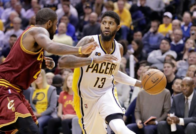 Paul George (R) of the Indiana Pacers has been sidelined with a left ankle injury and a so