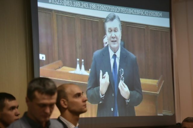 Former Ukrainian president Viktor Yanukovych addresses a court in Kiev via a live video li