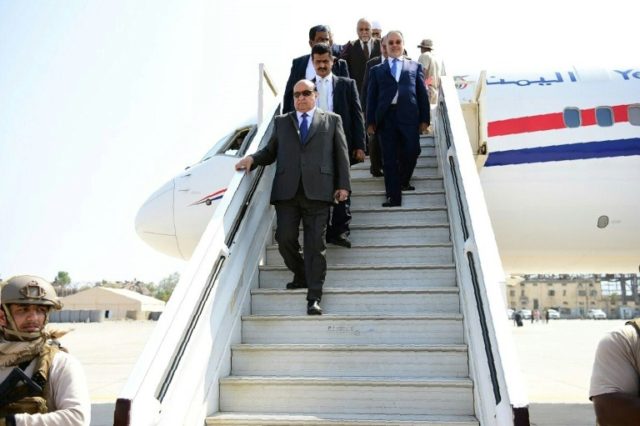 Yemeni President Abedrabbo Mansour Hadi (C) disembarks from a plane upon his arrival at Ad