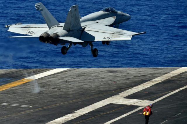 An FA-18 Super Hornet takes off from the US Navy's super carrier USS Dwight D. Eisenhower