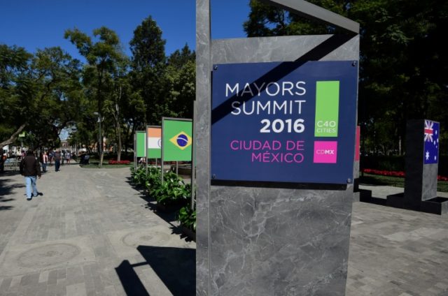 A sign announcing the Mayors Summit 2016 is seen at the Alameda Central Park in Mexico Cit