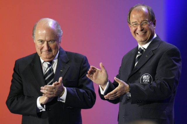 FIFA President Sepp Blatter (left) and FIFA General Secretary Urs Linsi applaud during the