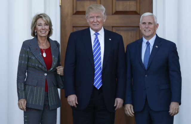 Donald Trump, Mike Pence, Betsy DeVos The Associated Press