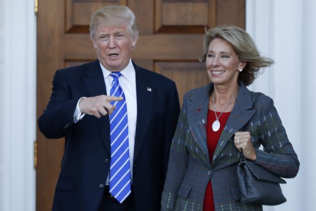 Donald Trump, Betsy DeVos The Associated Press