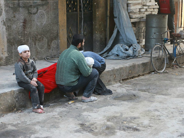 ALEPPO, SYRIA - NOVEMBER 16: A wounded kid is seen after war crafts belonging to the Syria