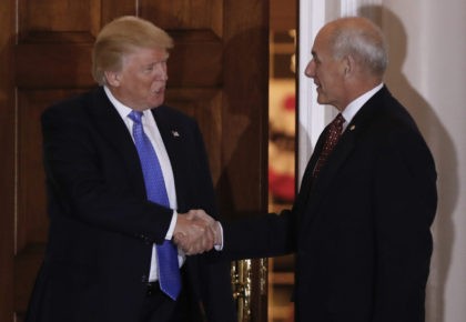 President-elect Donald Trump shakes hands with retired Marine Gen. John Kelly, right, at t