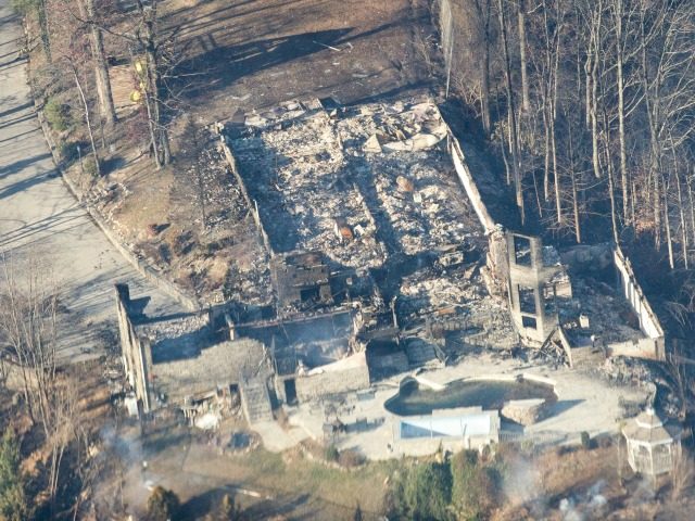 Burned structures are seen from aboard a National Guard helicopter near Gatlinburg, Tenn.,
