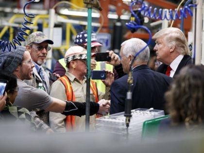 President-elect Donald Trump and Vice President-elect Mike Pence talk with factory workers during a visit to the Carrier factory, Thursday, Dec. 1, 2016, in Indianapolis, Ind. (AP Photo/Evan Vucci)