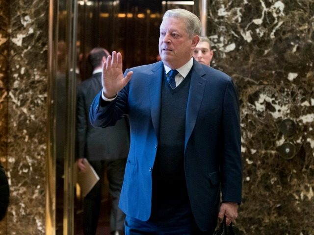 Former Vice President Al Gore waves to members of the media after meeting with Ivanka Trum