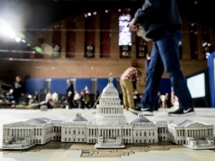 A model of the Capitol Building is displayed on a giant planning map during a media tour highlighting inaugural preparations being made by the Joint Task Force-National Capital Region for military and civilian planners, Wednesday, Dec. 14, 2016, at the DC Armory in Washington. (