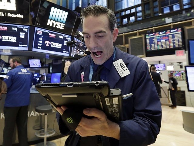 Trader Gregory Rowe works on the floor of the New York Stock Exchange, Friday, Dec. 16, 20