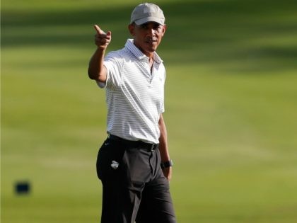 President Barack Obama walks across the 18th green at Kapolei Golf Club, in Kapolei, Hawai