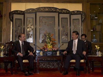 Pakistan Prime Minister Nawaz Sharif (2nd L) talks to Chinese President Xi Jinping (2nd R) as their wives, Pakistan First Lady Begum Kulsoom Nawaz Sharif (L) and Chinese first lady Peng Liyuan (R) sit during a meeting at the Diaoyutai State guest house in Beijing on July 4, 2013. Pakistan …