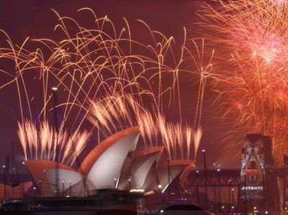 New Year's Eve fireworks erupt over Sydney's iconic Harbour Bridge and Opera House during the traditional fireworks show held at midnight early on January 1, 2016. AFP PHOTO / Peter PARKS / AFP / PETER PARKS (Photo credit should read PETER PARKS/AFP/Getty Images)