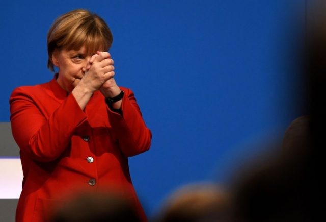 German Chancellor Angela Merkel thanks after addressing delegates during her conservative Christian Democratic Union (CDU) party's congress in Essen, western Germany, on December 6, 2016. German Chancellor Angela Merkel launches into campaign mode for elections taking place in 2017. / AFP / PATRIK STOLLARZ (Photo credit should read PATRIK STOLLARZ/AFP/Getty …