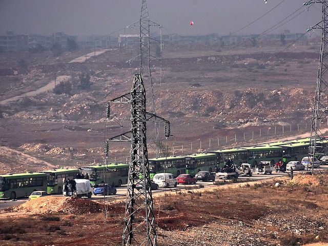 Buses are seen during an evacuation operation of Syrian rebel fighters and civilians from