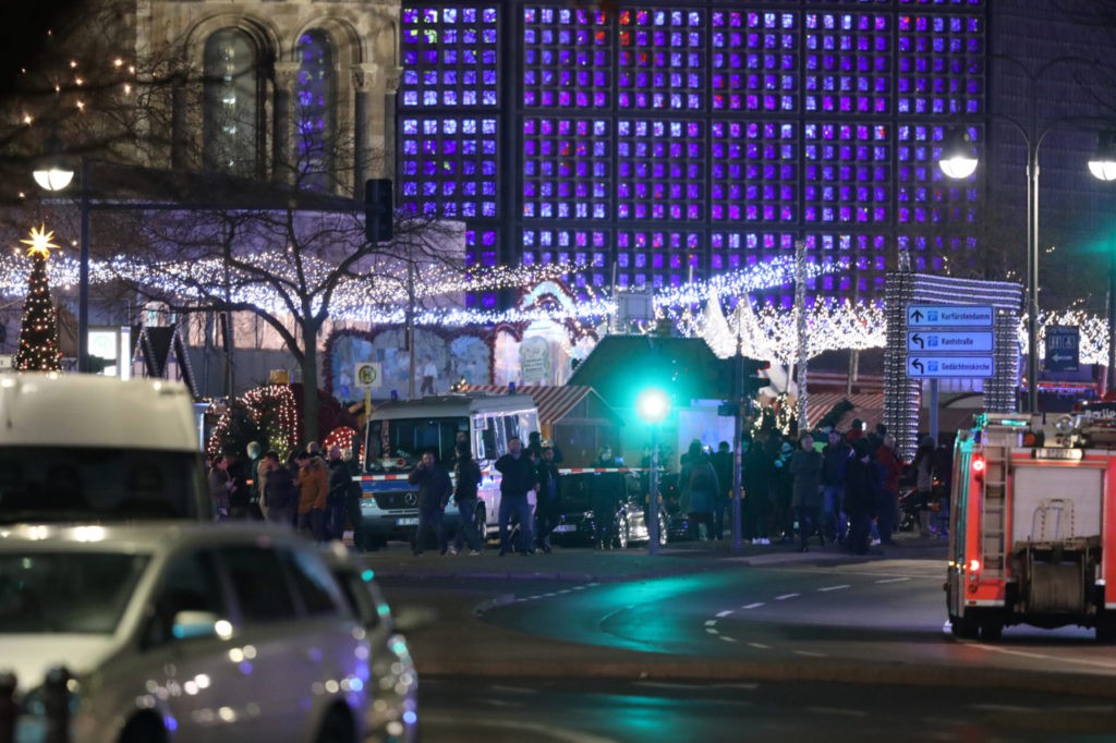 BERLIN, GERMANY - DECEMBER 19: Rescue workers arrive to the area after a lorry truck ploughed through a Christmas market on December 19, 2016 in Berlin, Germany. Several people have died while dozens have been injured as police investigate the attack at a market outside the Kaiser Wilhelm Memorial Church on the Kurfuerstendamm and whether it is linked to a terrorist plot. (Photo by Sean Gallup/Getty Images)